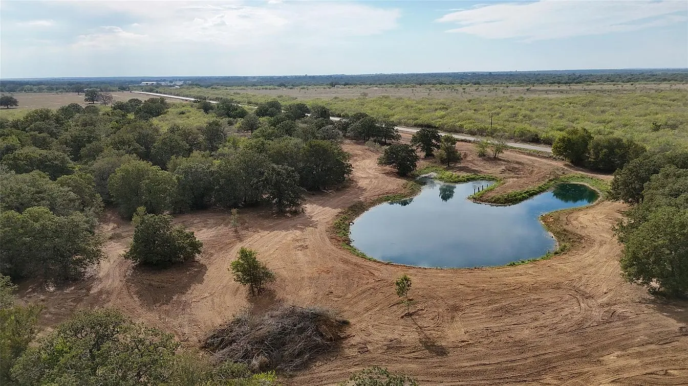 Drone view of the corner tract pond and cleared ground